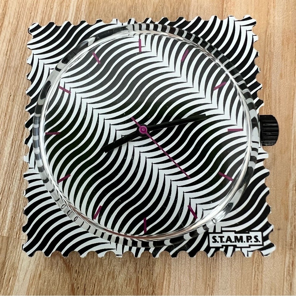 S.T.A.M.P.S. Interchangeable watch face with black white illusion pattern
